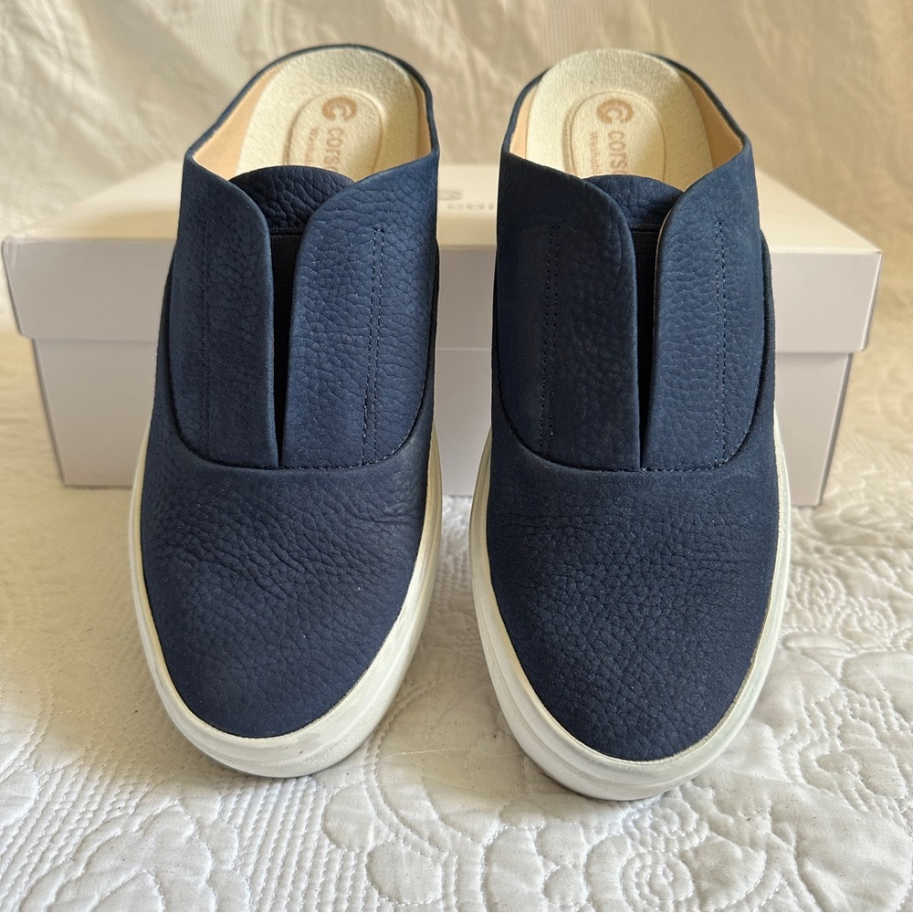 Slip-on, backless sneakers.